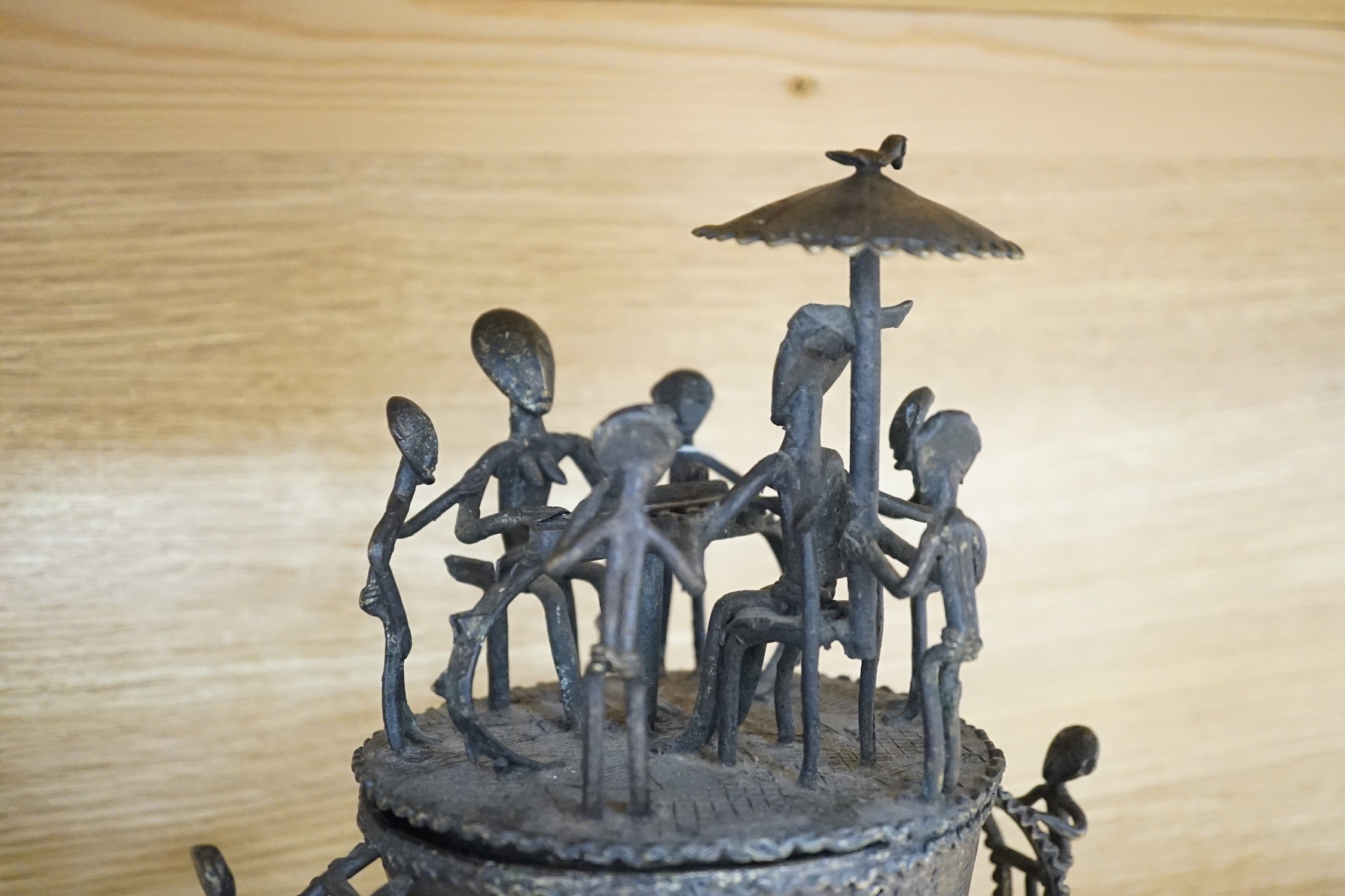 A collection of four Ashanti bronze figural vessels, and nine single figures, tallest 29cms high